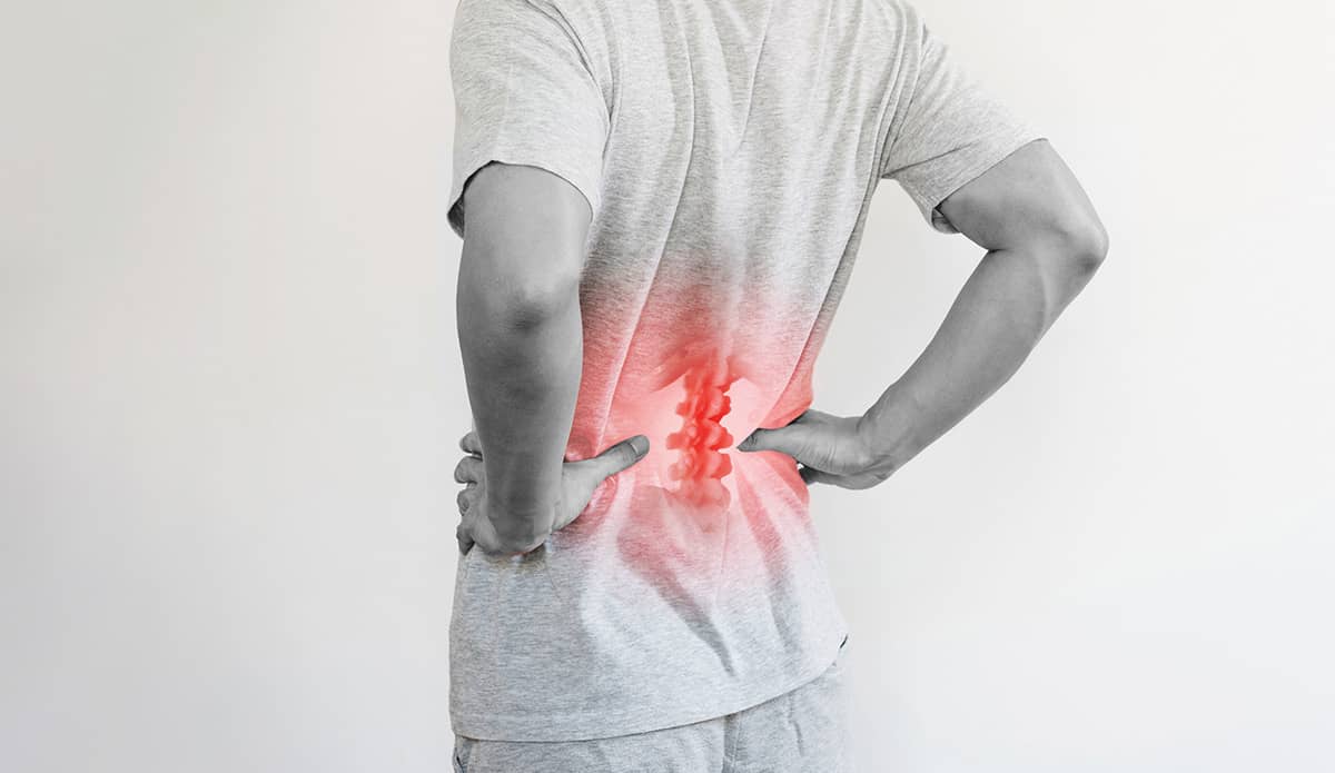 Lumbar disc replacement is performed through an anterior approach incision below the belly button.